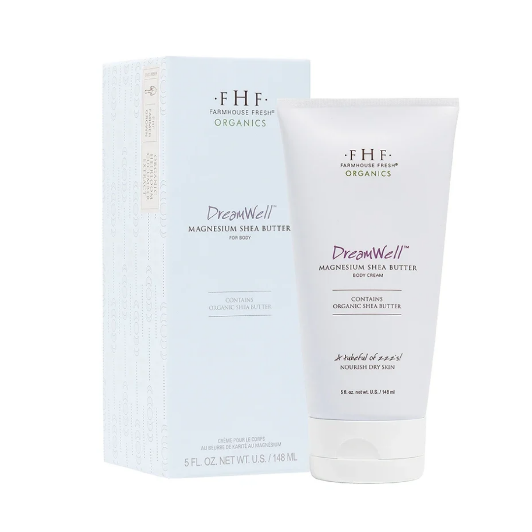 FHF Farmhouse Fresh Organics DreamWell Magnesium Shea Butter body cream in a white squeeze tube next to its light blue and white packaging box, on a white background.