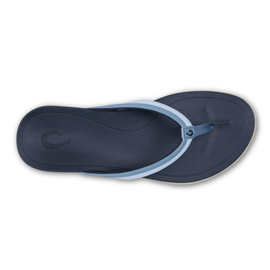 Navy blue sandal with a white sole on a white background