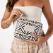 Person holding a patterned pouch with 'Aloha' label against a white background