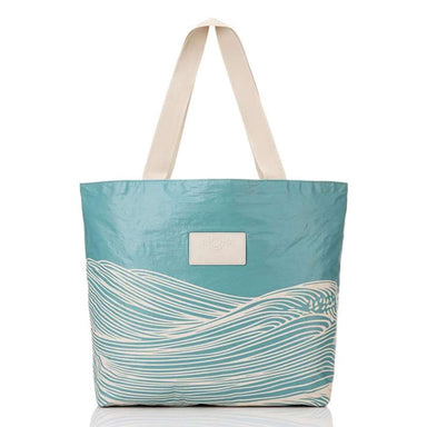teal bag with wave design on white background