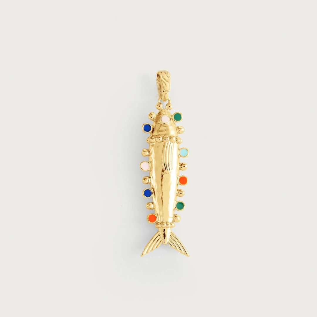 Gold fish-shaped pendant with colorful accents on a light gray background