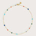 Necklace with colorful beads on a light gray background