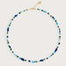 Necklace with blue and green beads on a white background