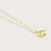 Gold necklace with an shell pendant on a light gray background