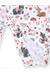 A close-up of a white fabric garment, likely a baby blanket or soft toy, featuring an all-over woodland print with bears, deer, mushrooms, flowers, and leaves in muted earthy tones.