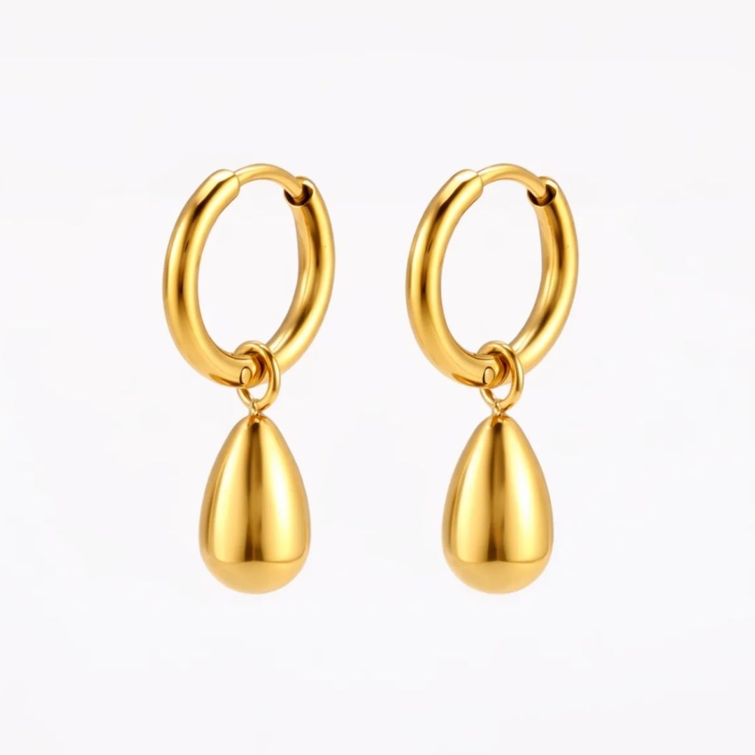 A pair of gold hoop earrings with teardrop-shaped dangling charms, shown on a clean white background.