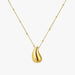 A gold necklace featuring a smooth, teardrop-shaped pendant with a polished finish and a delicate beaded chain, shown against a plain light gray background.
