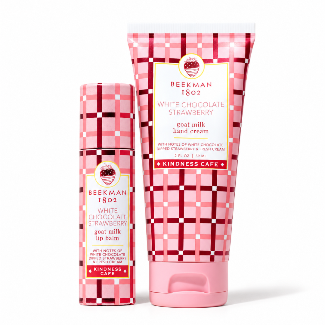 Two pink and white patterned BEEKMAN 1802 hand cream and lip balm tubes on a white background.