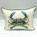 An off-white textured throw pillow with dark green piping, featuring a printed design of a green and blue crab with the words 'SEVERNA PARK' across the front, set against a light gray background.
