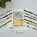 Cross-stitch kit with lemons on a white background