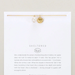 Gold bracelet with pearls on a white card featuring 'Sheltered' brand text.