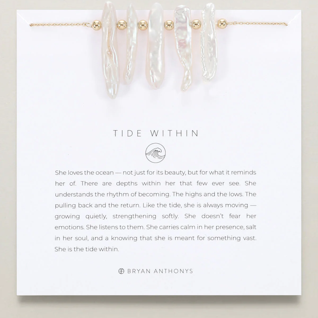 Jewelry set with 'Tide Within' description and branding on a white card.