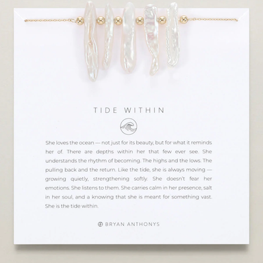 Jewelry set with 'Tide Within' description and branding on a white card.