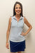 Woman wearing white half zip tank top with blue floral pattern detail 