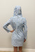 Woman wearing blue and white striped dress with lace up neck