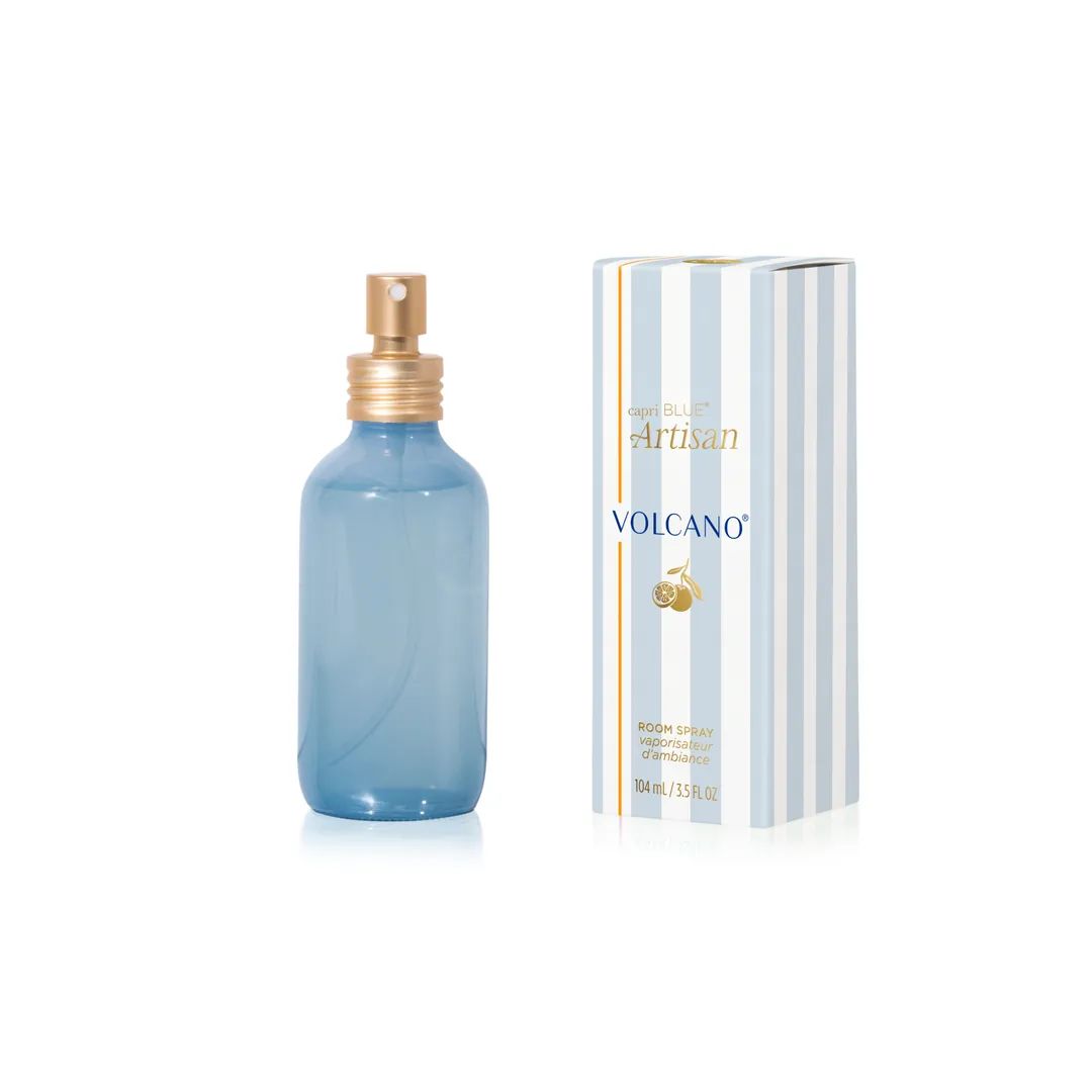 Blue spray bottle with gold cap and striped box on a white background