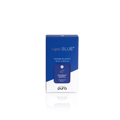 A blue and white box of Pura Capri Blue Coconut Santal fragrance refill, shown on a clean white background with a soft reflection below.