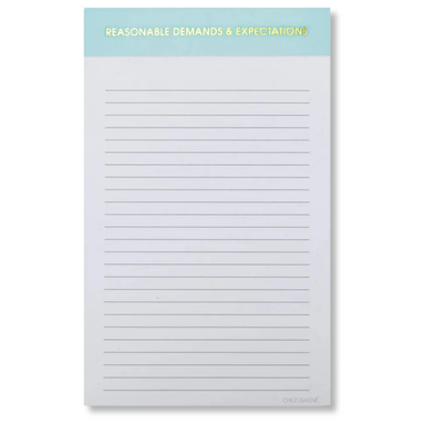 A lined notepad with a light blue header band at the top that reads 'REASONABLE DEMANDS & EXPECTATIONS' in yellow text. The notepad has thin horizontal gray lines across a white page and is photographed on a light gray background.