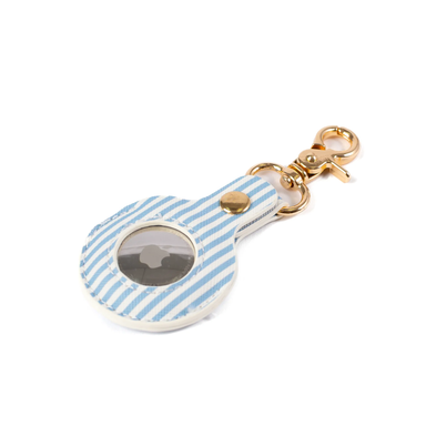 Blue and white striped keychain case with gold accents on a white background