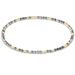 Bracelet with alternating gold and silver beads on a white background