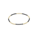 Beaded bracelet with black and gold beads on a white background