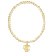 Gold beaded bracelet with a heart-shaped pendant on a white background