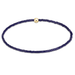 Navy blue beaded necklace with a gold clasp on a white background