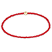 Red beaded necklace with a gold clasp on a white background