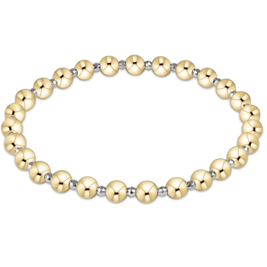 Gold beaded bracelet on a white background