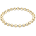 Gold beaded bracelet on a white background