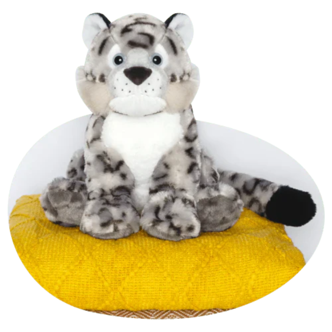 plush snow leopard on white background