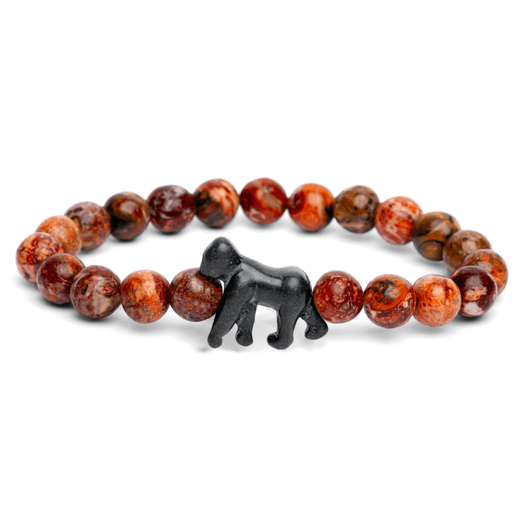Bracelet with red and brown beads and a black bear charm on a white background