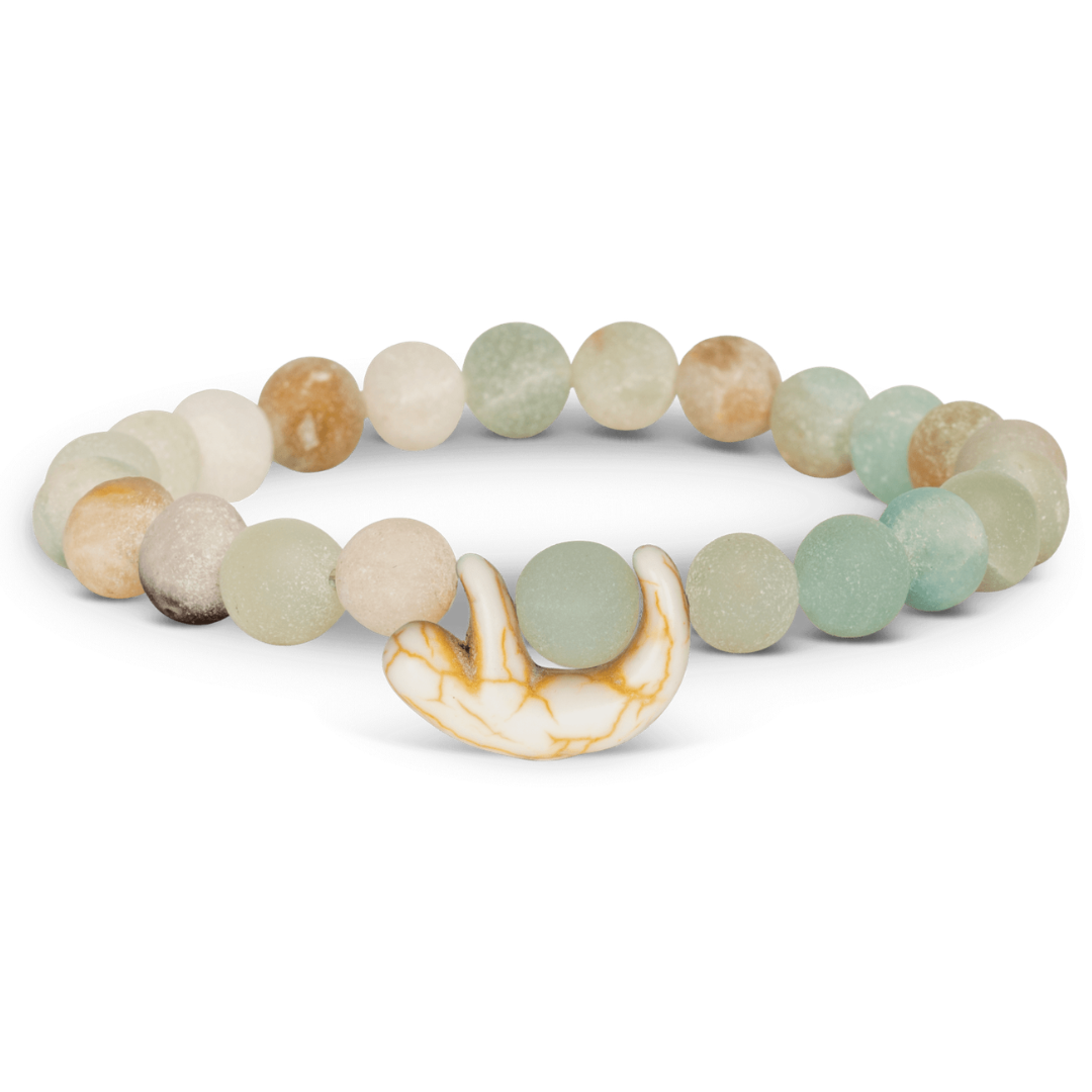 Multicolored beaded bracelet with a decorative element on a white background
