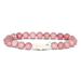 Pink beaded bracelet with a white charm on a white background