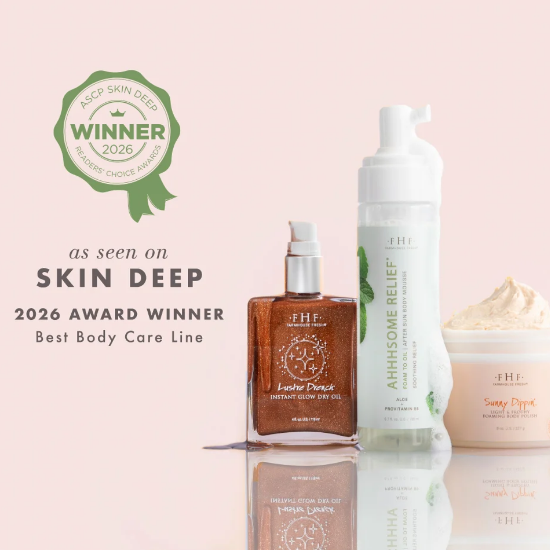 Four EHF body care products arranged on a pale pink background with a green 'ASCD Skin Deep Winner 2026' award seal and award text. The products include an amber bottle, a white pump bottle, and a cream jar, with reflections below.