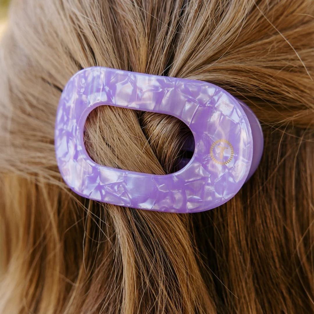 purple hair clip in models hair