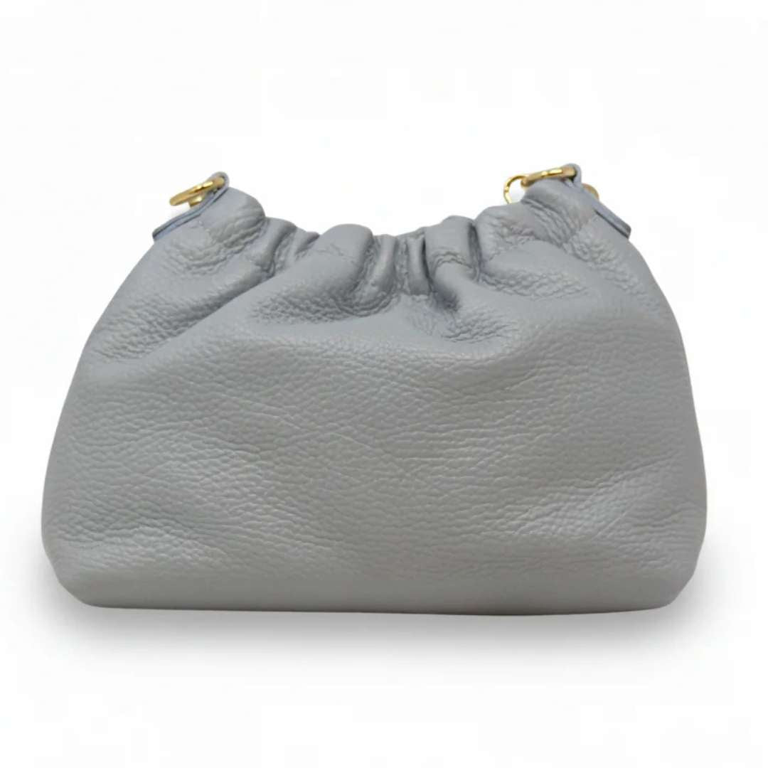 Gray handbag with gold accents on a white background