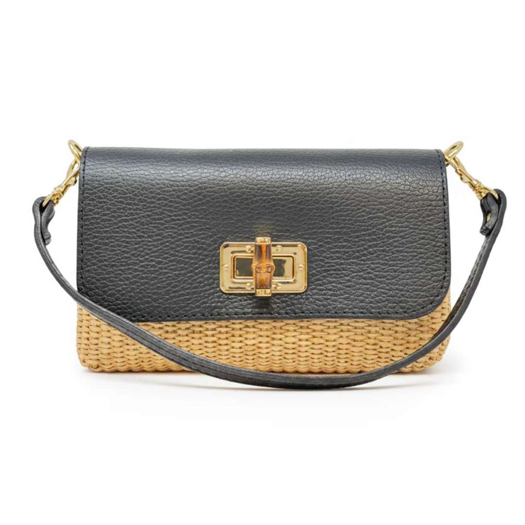 Black leather and woven straw handbag with gold clasp on a white background