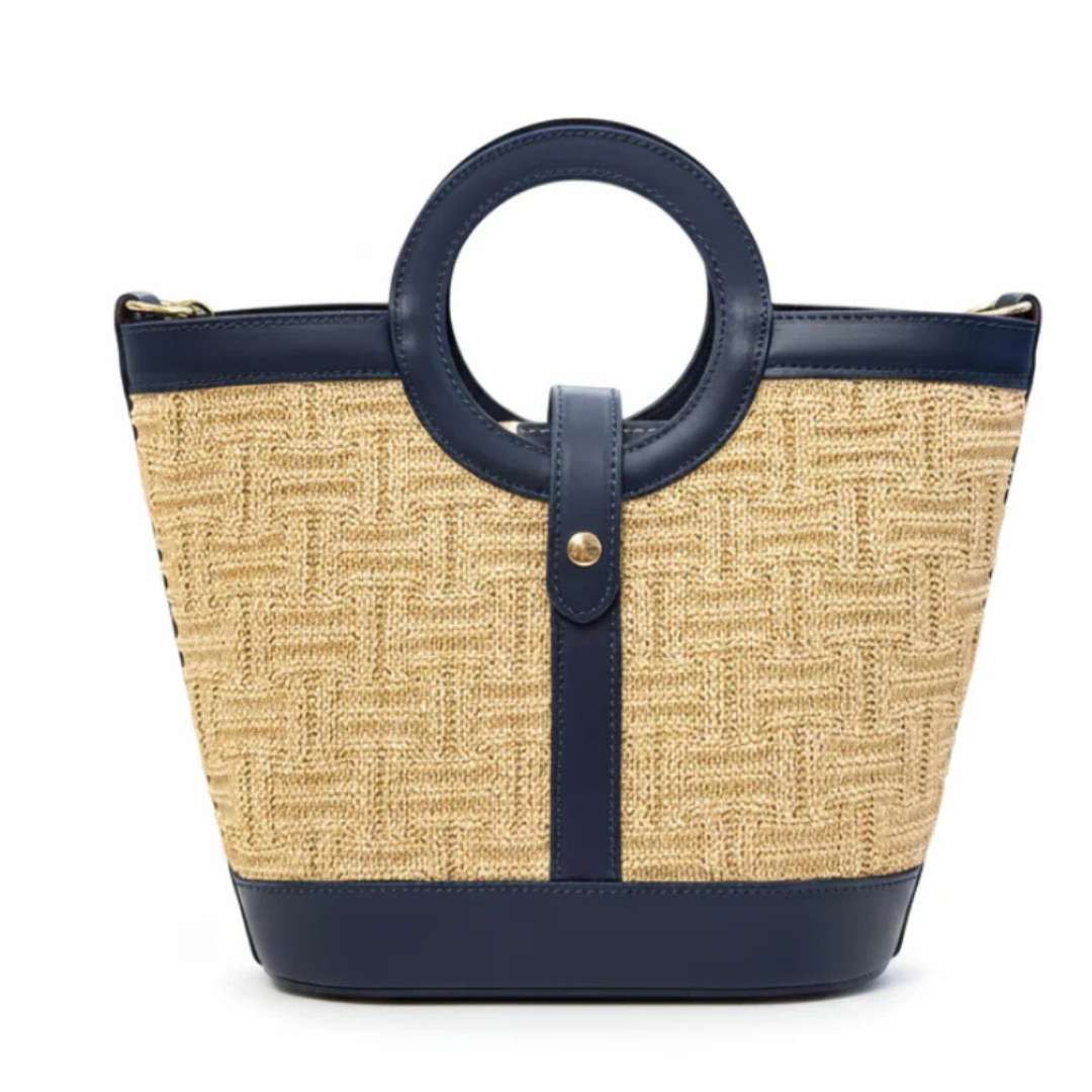 Woven handbag with navy accents on a white background