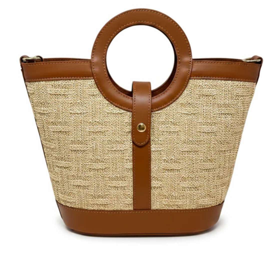Beige woven handbag with brown leather accents on a white background