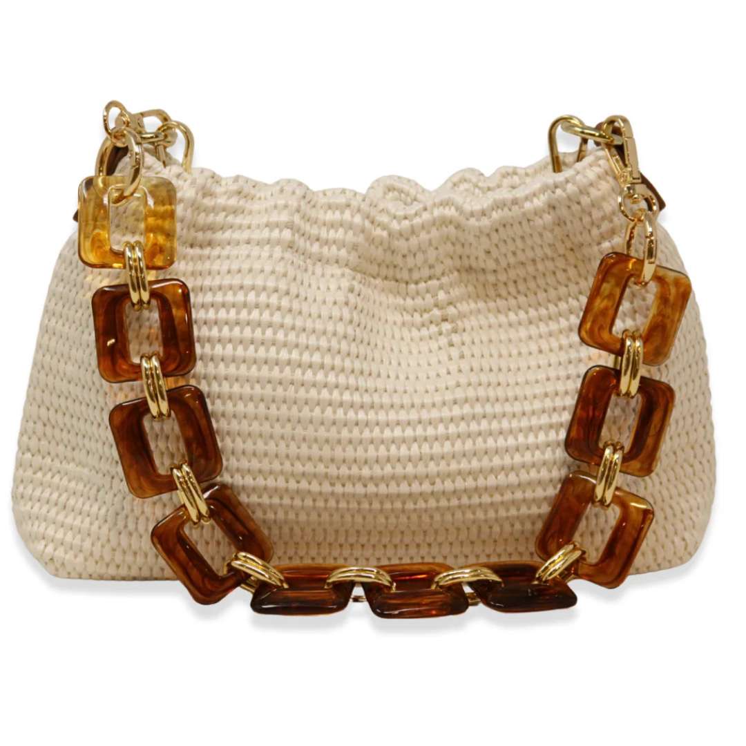 Beige woven handbag with a brown and gold chain strap on a white background
