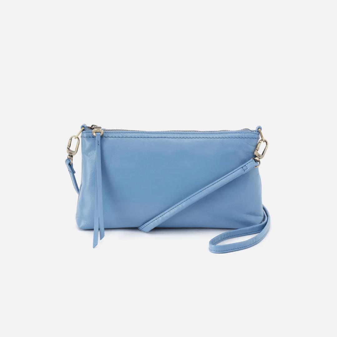 Blue handbag with a strap on a white background