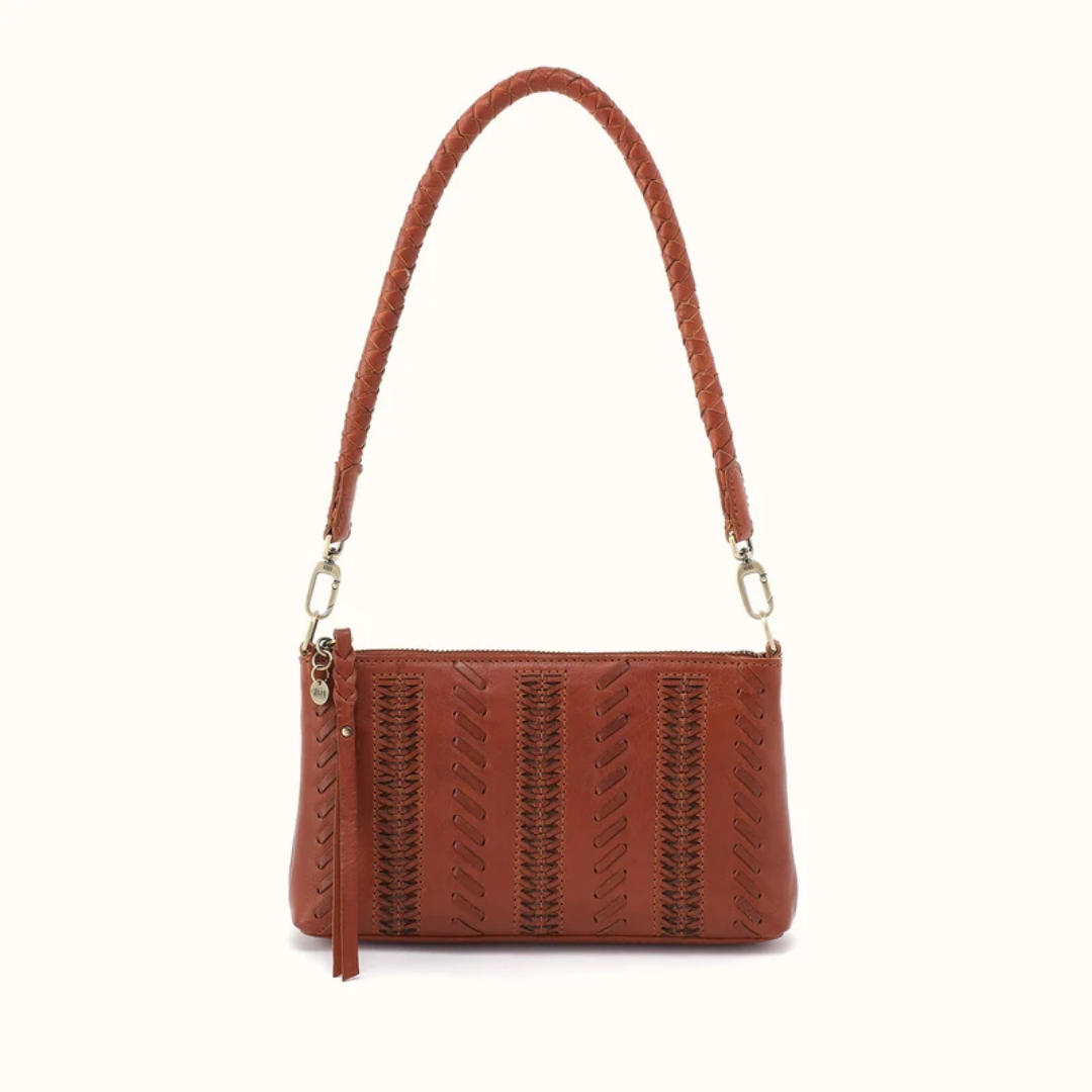 A brown leather shoulder bag with a braided strap and vertical stitched details, shown against a plain off-white background.