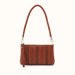 A brown leather shoulder bag with a braided strap and vertical stitched details, shown against a plain off-white background.