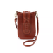 A brown leather crossbody bag with a front strap detail, shown on a plain white background.