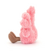 Pink plush bunny toy with brown feet on a white background