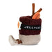 A Jellycat plush toy shaped like a cinnamon latte, featuring a dark brown textured body, a beige base, a black band with white 'JELLYCAT' text, and brown cinnamon sticks sticking out of the top, shown on a white background.
