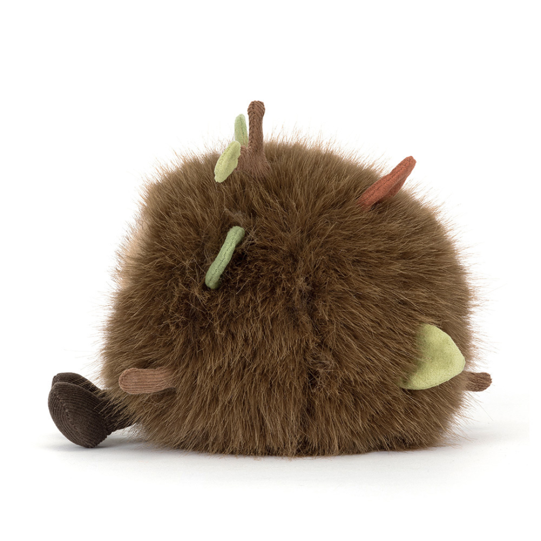 soft brown ball of fluff with sticks and twigs comming out on white background