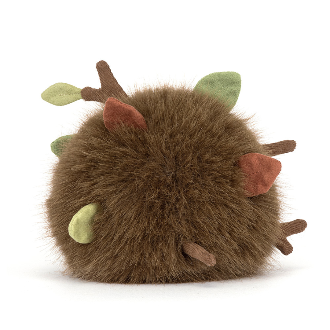 soft brown ball of fluff with sticks and twigs comming out on white background