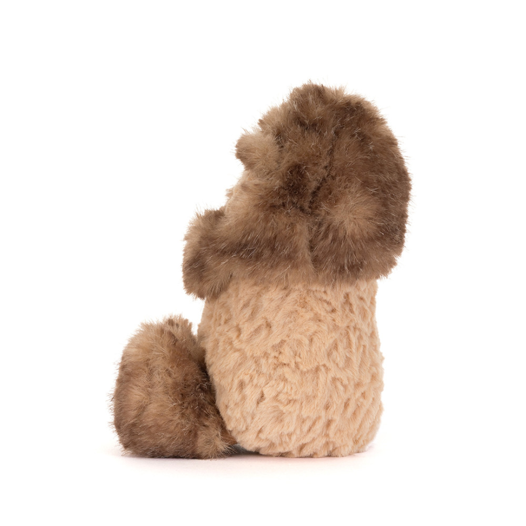 peanut stuffed animal white fur around head and feet against white background